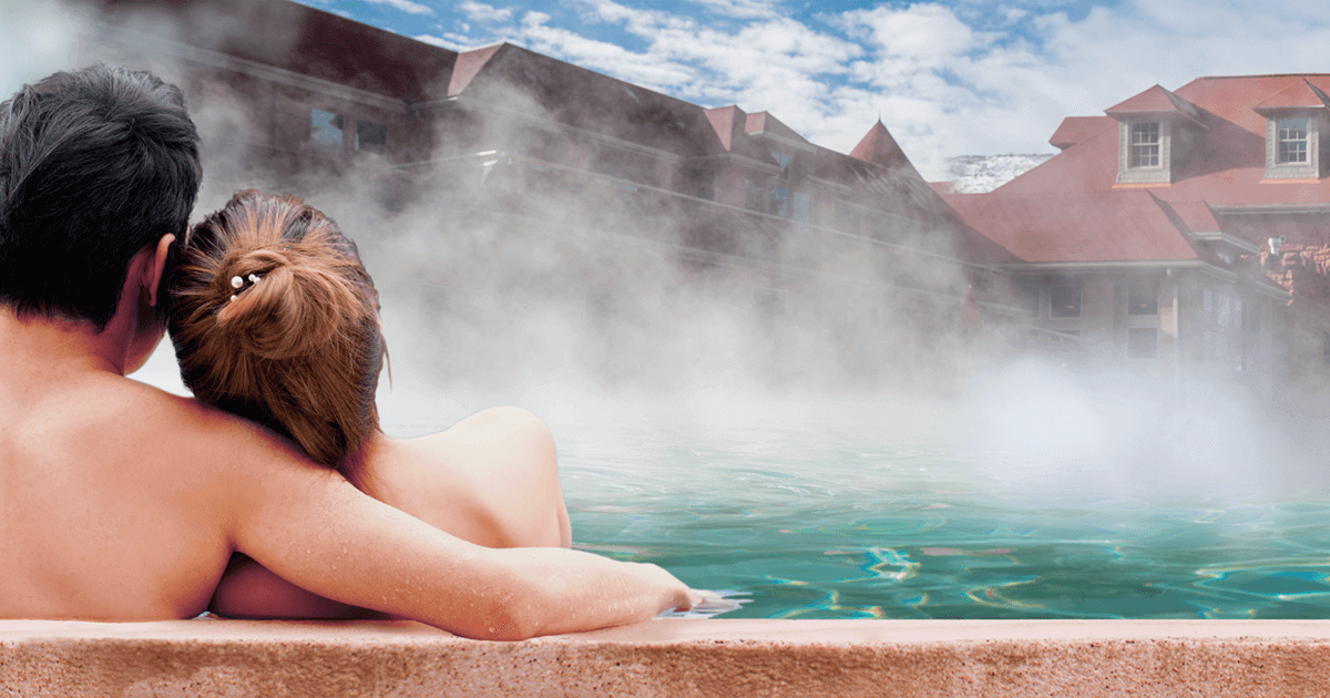 couple in hot springs pool
