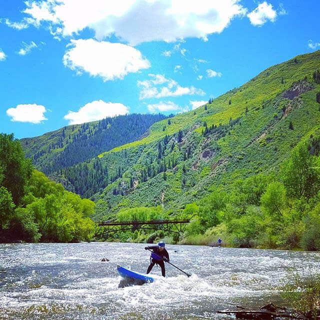 Stand up paddleboarding on the roaring fork river