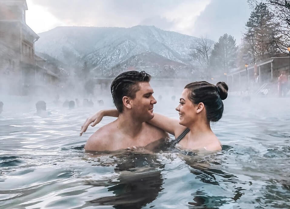 couple in hot springs pool
