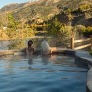 Mother and daughter soaking at Iron Mountain Hot Springs in autumn