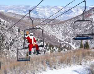 Santa riding the ski lift at Sunlight Mountain Resort