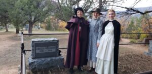 women dressed in costume for the linwood Cemetary ghost walk 