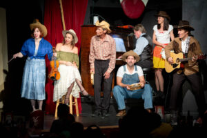 Cast of the Vaudeville Revue performing a song