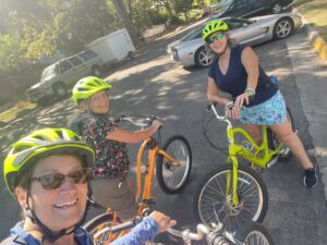 Three friends riding bikes