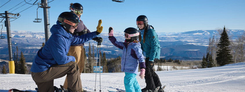 Skiers high five at Sunlight Ski Resort