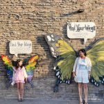 Mom and Daughter pose in front of Glenwood Wings