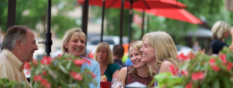 People enjoying summer outdoor dining in Glenwood Springs