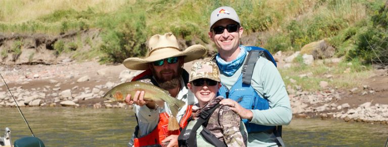 man and son fishing with a guide