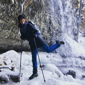 hiker with poles at spouting rock photo by @laurenjaneloves